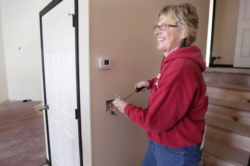 electrician fixing outlet